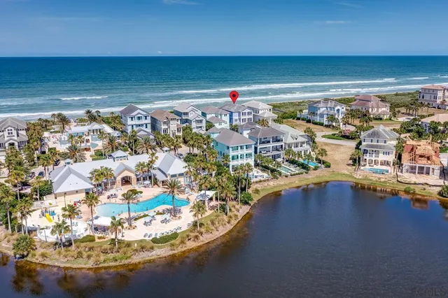 a front view of a residential apartment building with a yard