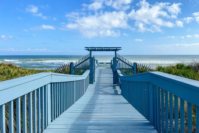 an outdoor space with swimming pool and seating