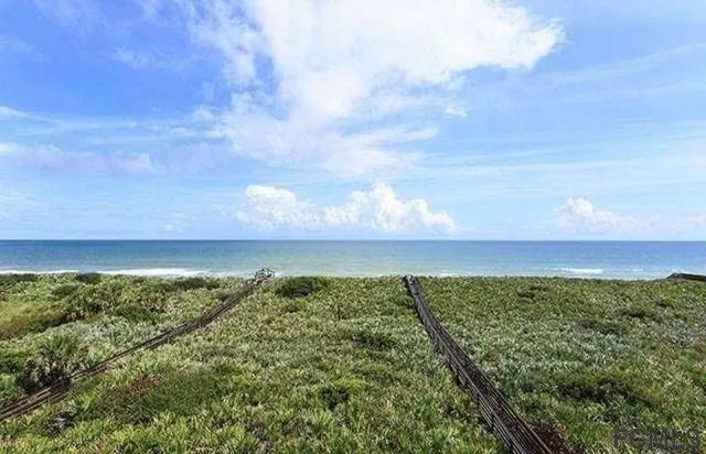 a view of a swimming pool with outdoor seating