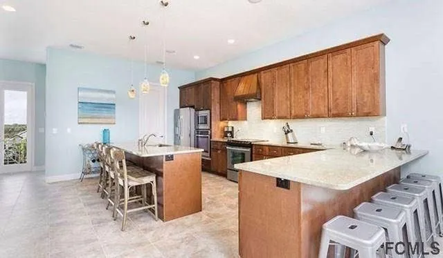 a kitchen with a sink a counter top space and appliances