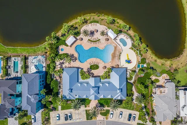 a living room with furniture a table and wooden floor