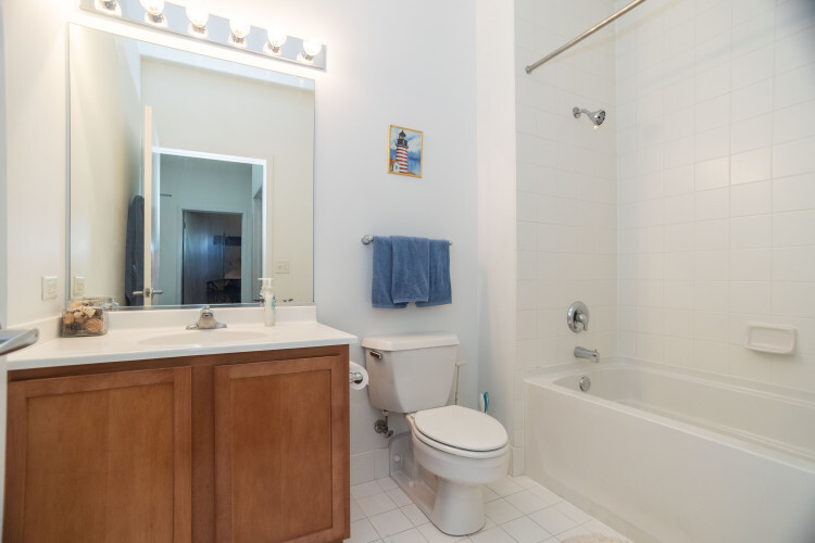 2323 West Pershing Road, Unit 140 Chicago, IL 60609 - Photo 16 of 18 a bathroom with a sink toilet and shower