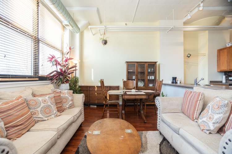 2323 West Pershing Road, Unit 140 Chicago, IL 60609 - Photo 4 of 18 a living room with furniture and a large window