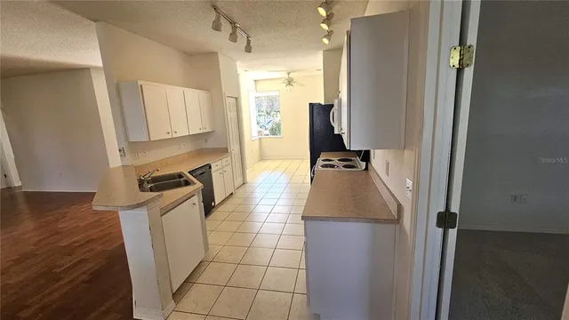 a hallway with a view of living room