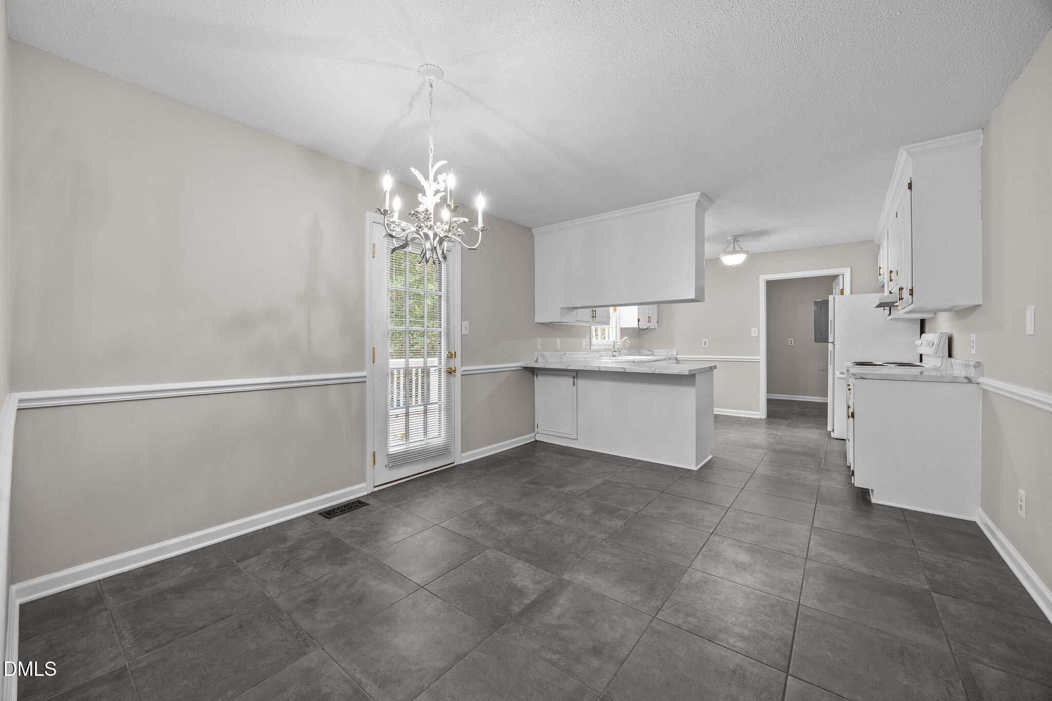 8405 Bells Lake Road Apex, NC 27539 - Photo 10 of 44 a view of a kitchen with electric appliances