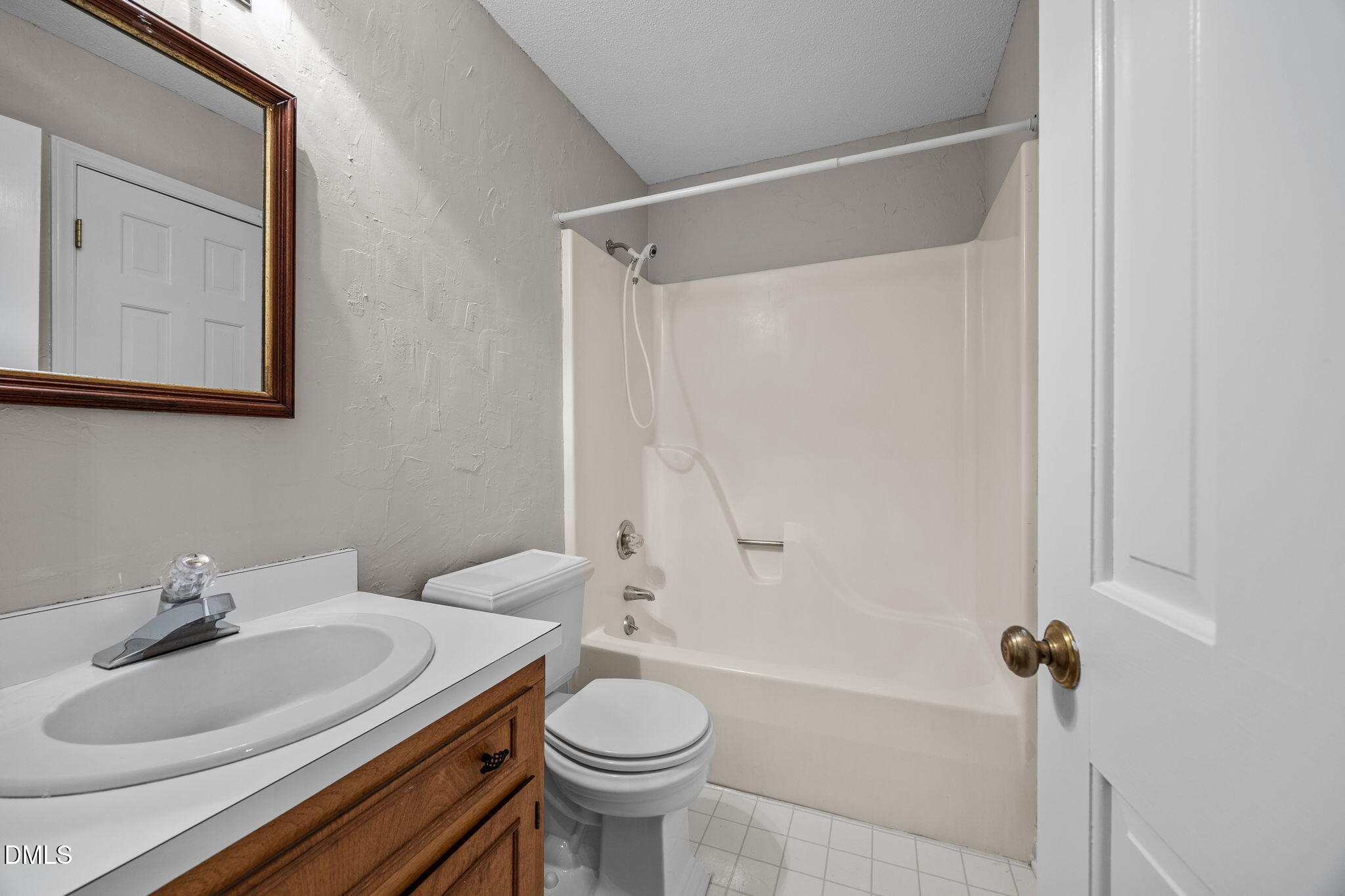 8405 Bells Lake Road Apex, NC 27539 - Photo 16 of 44 a bathroom with a sink a toilet and shower