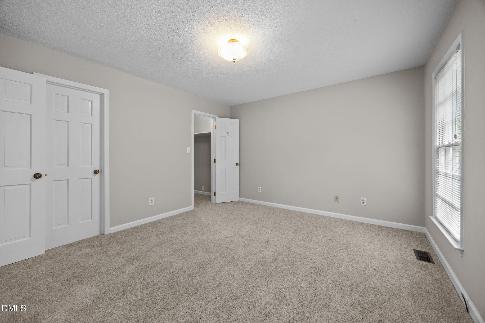 8405 Bells Lake Road Apex, NC 27539 - Photo 18 of 44 a view of an empty room with a window