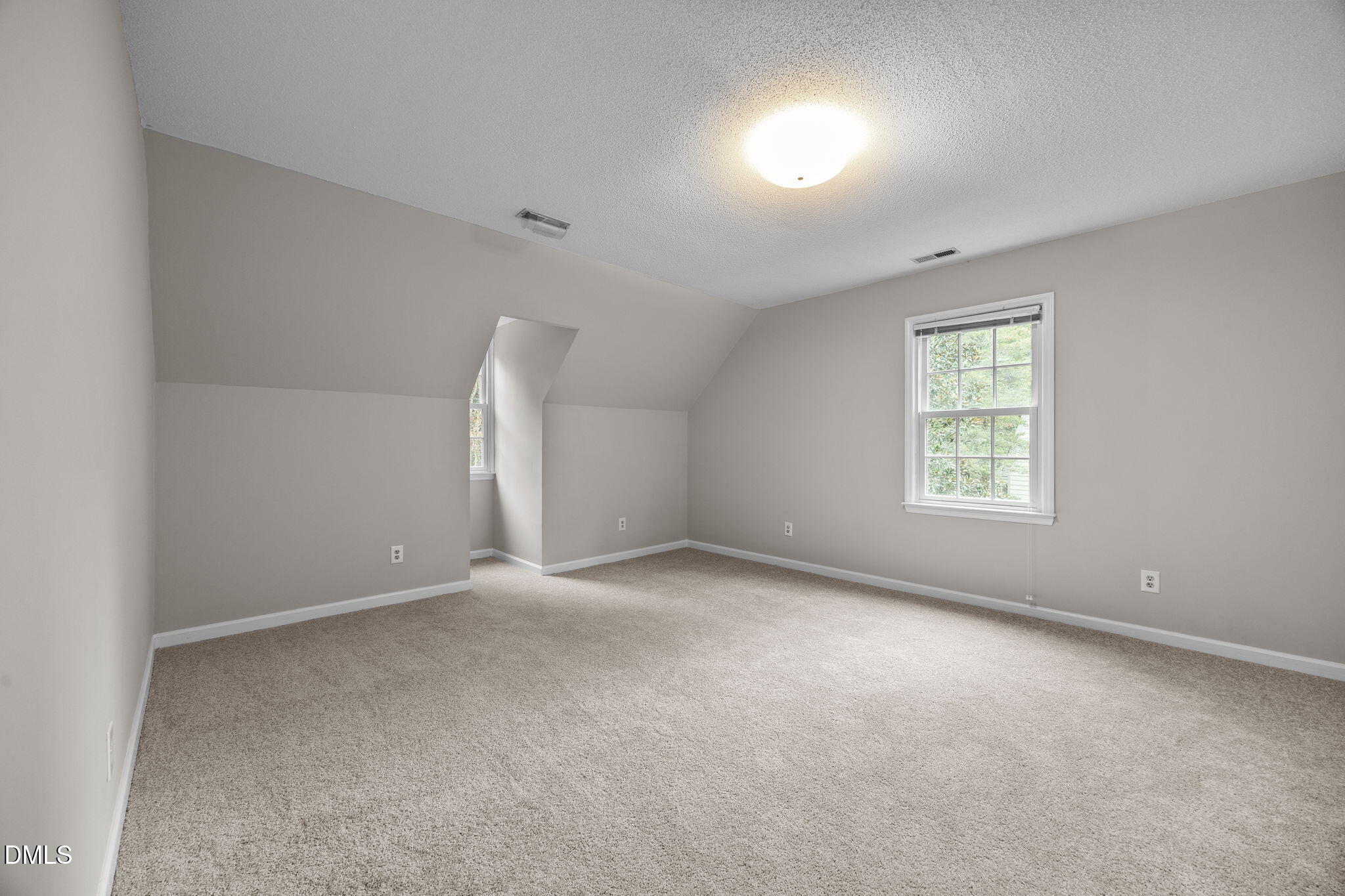 8405 Bells Lake Road Apex, NC 27539 - Photo 21 of 44 an empty room with a window and a kitchen