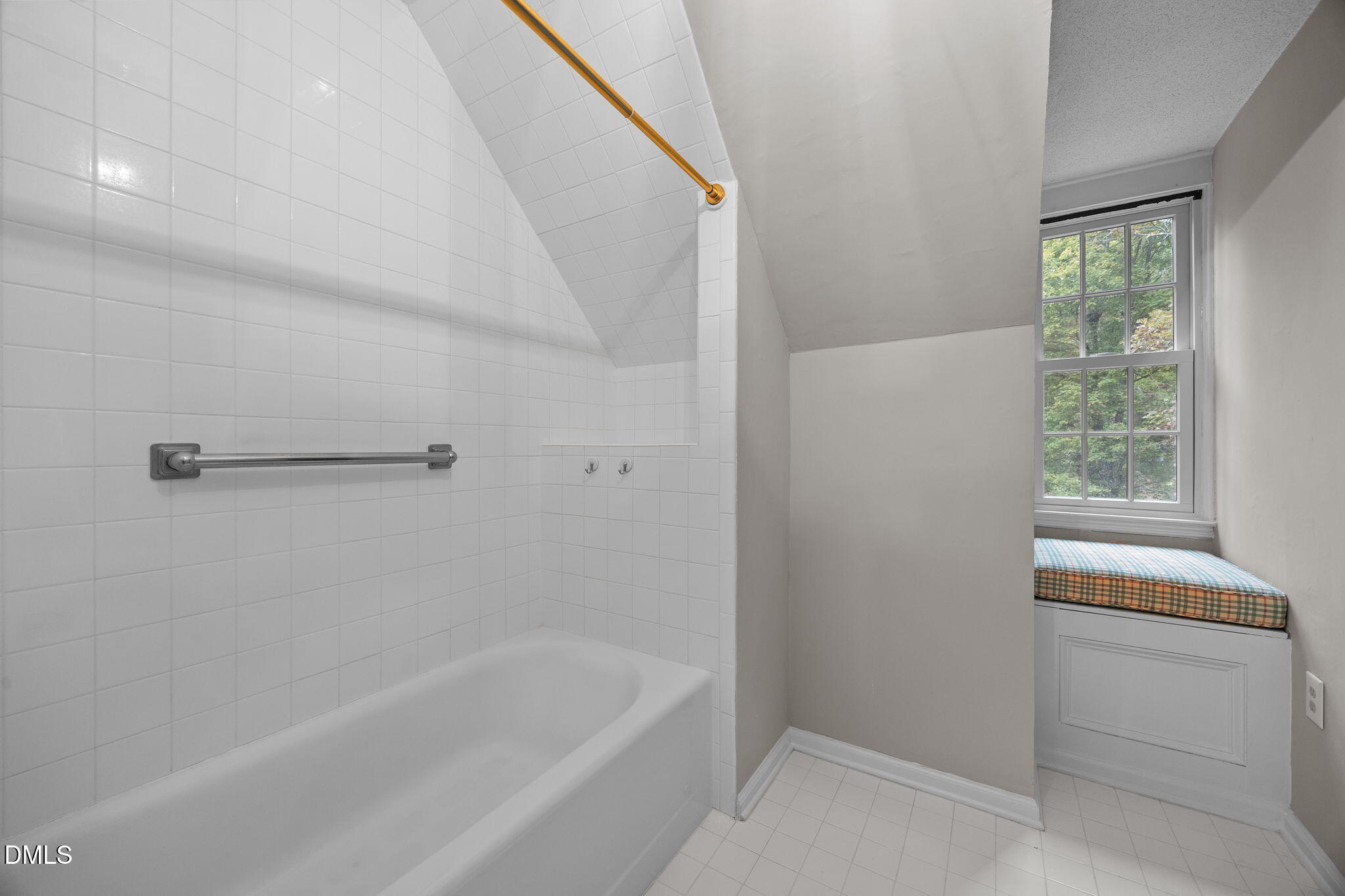 8405 Bells Lake Road Apex, NC 27539 - Photo 25 of 44 a bathroom with a bathtub