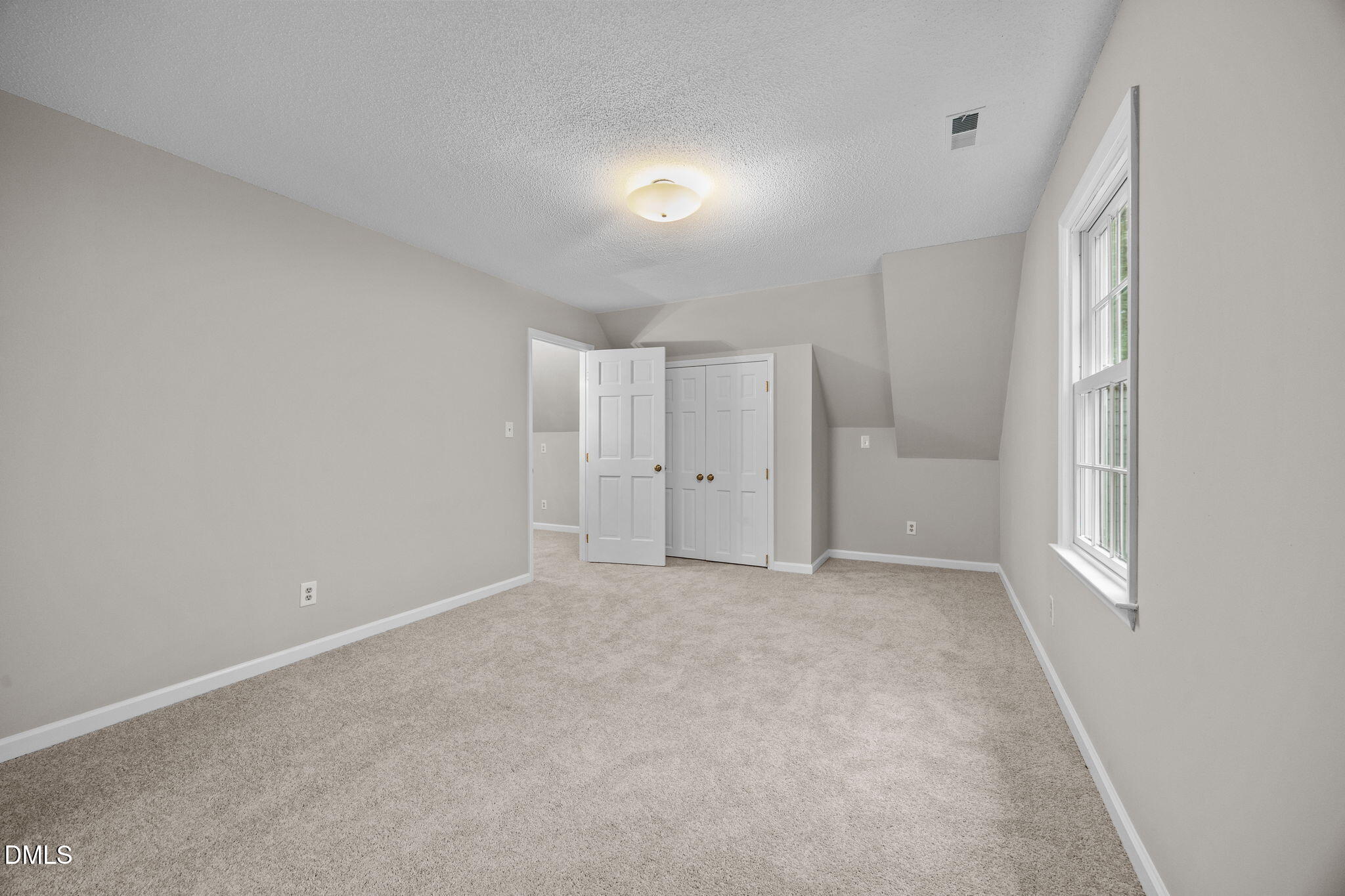 8405 Bells Lake Road Apex, NC 27539 - Photo 27 of 44 a view of an empty room with a window