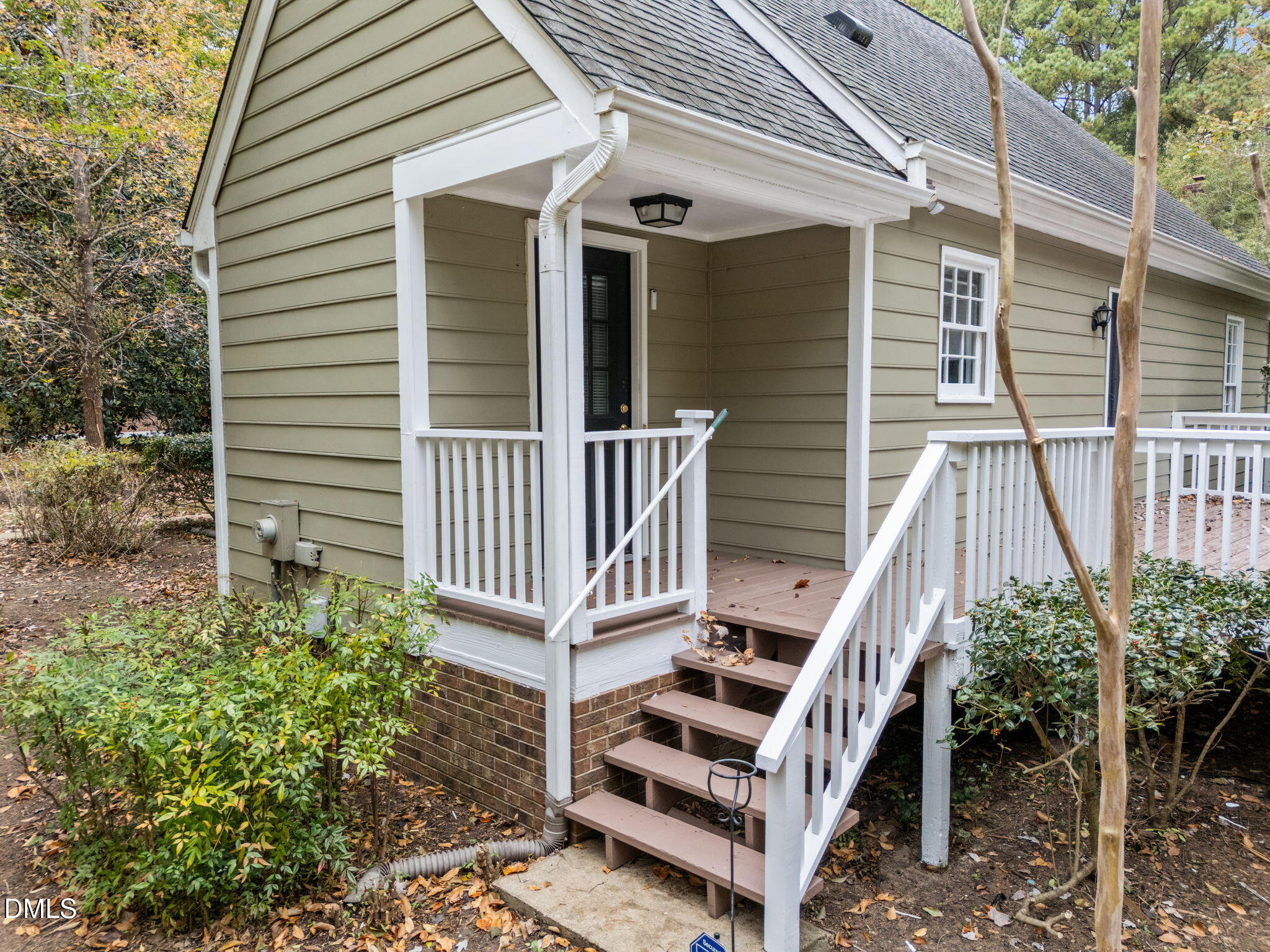 8405 Bells Lake Road Apex, NC 27539 - Photo 29 of 44 a view of a house with wooden deck