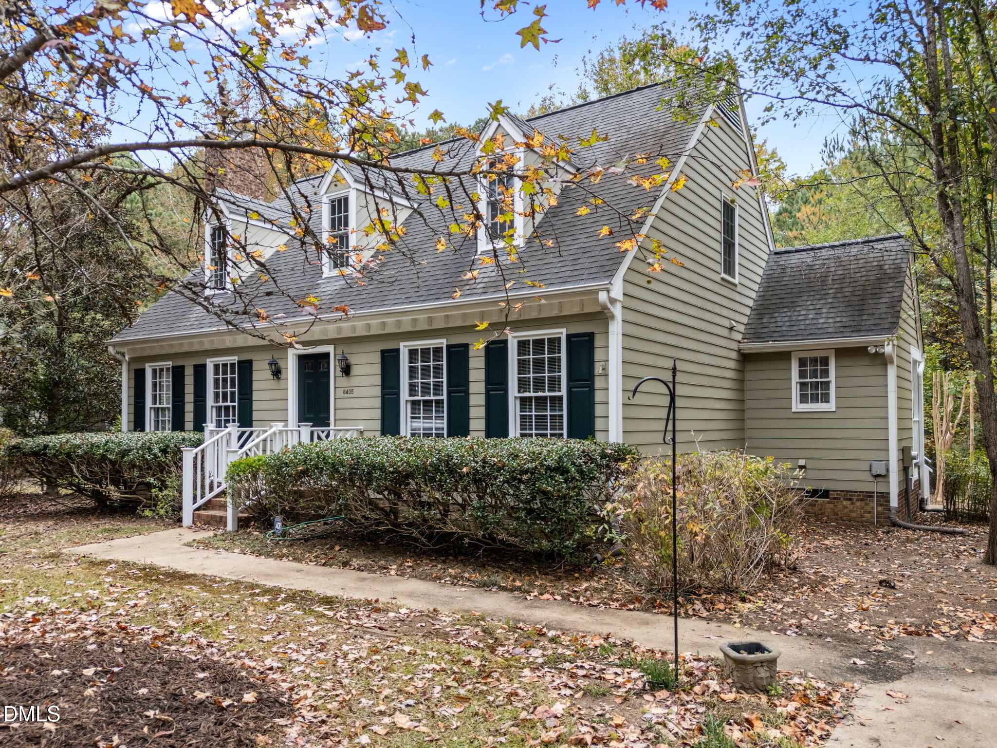 8405 Bells Lake Road Apex, NC 27539 - Photo 2 of 44 a front view of a house with garden