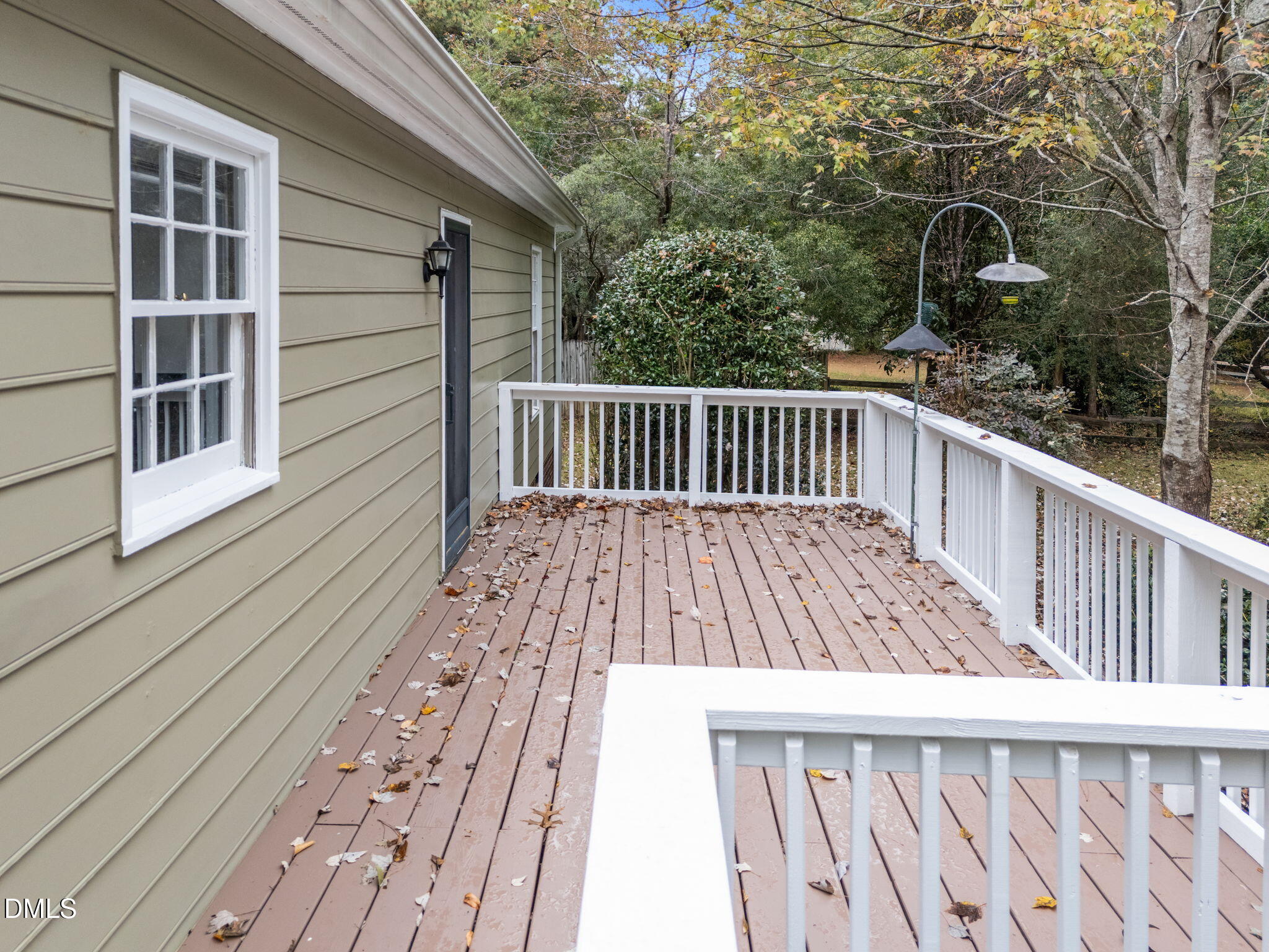 8405 Bells Lake Road Apex, NC 27539 - Photo 31 of 44 a view of balcony with wooden floor and fence