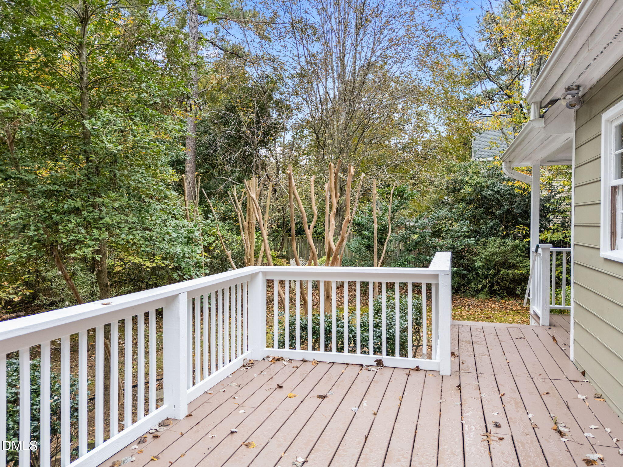 8405 Bells Lake Road Apex, NC 27539 - Photo 32 of 44 a view of backyard with a deck and wooden floor
