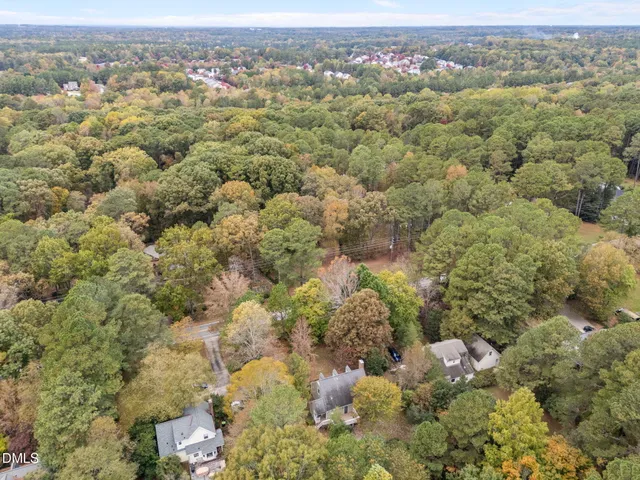 an aerial view of a houses with a yard
