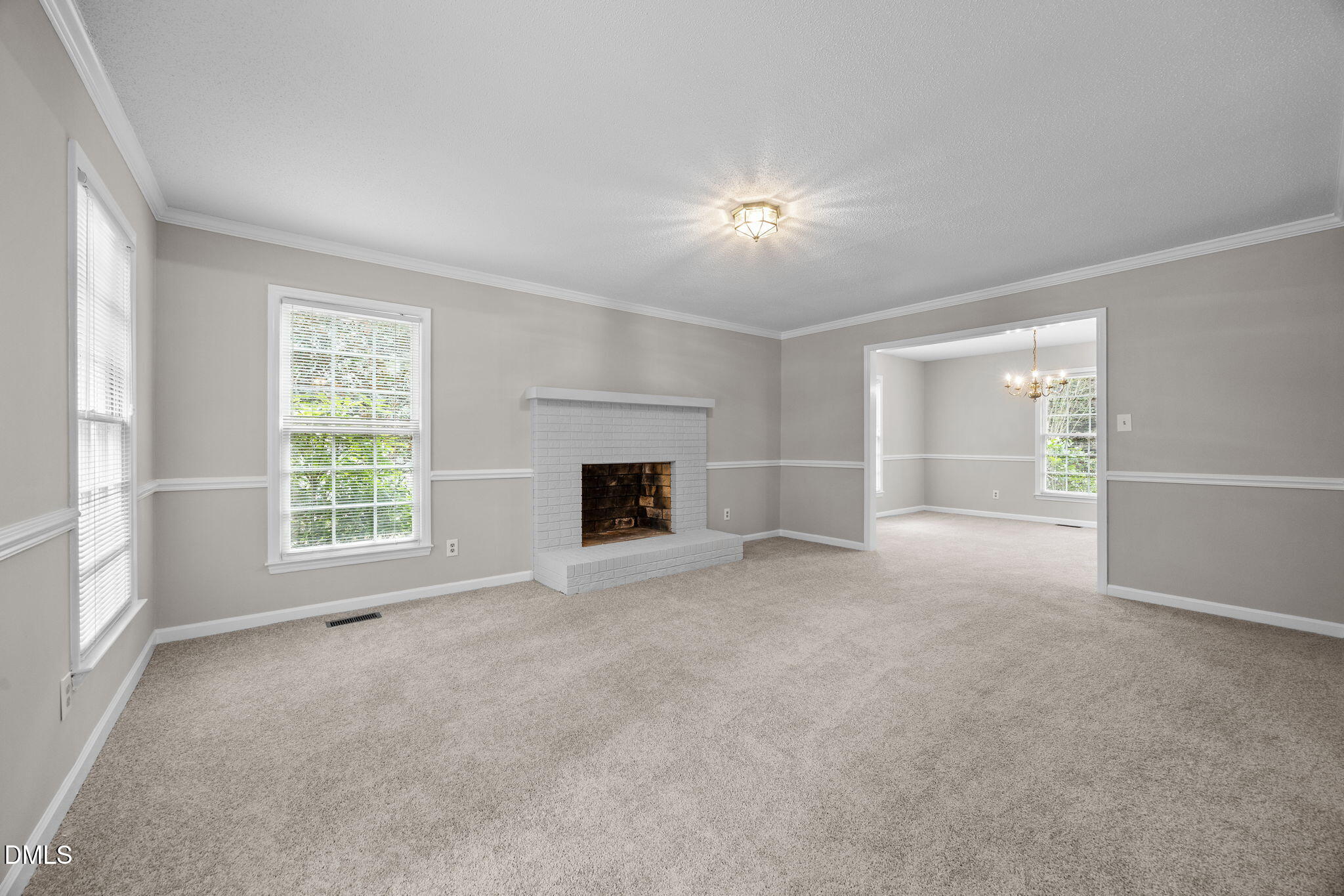 8405 Bells Lake Road Apex, NC 27539 - Photo 6 of 44 a view of empty room with a fireplace