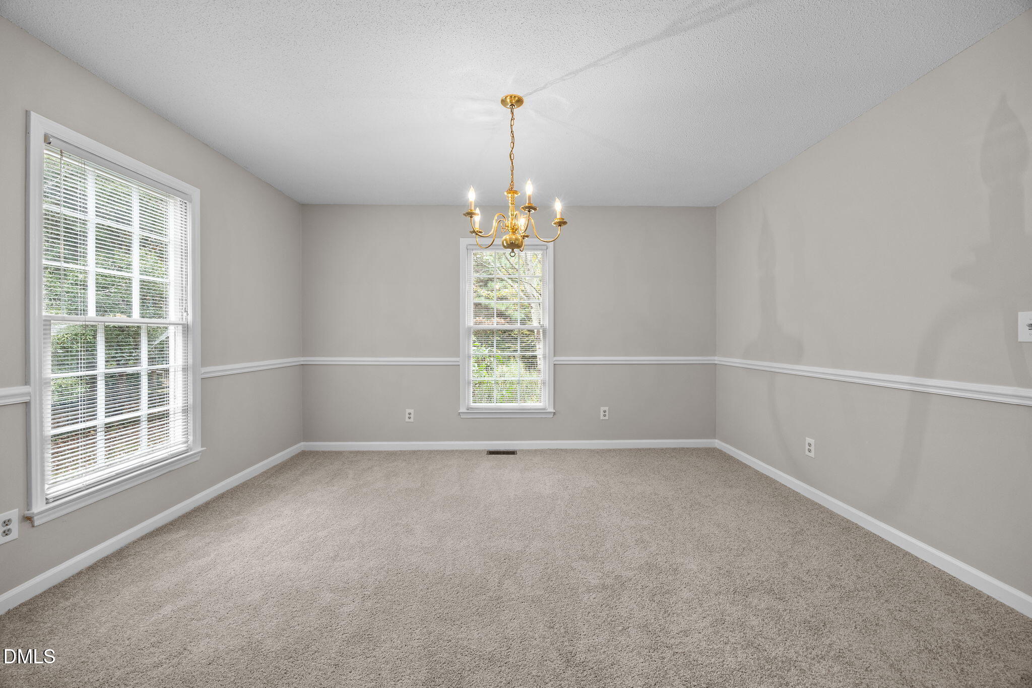 8405 Bells Lake Road Apex, NC 27539 - Photo 8 of 44 a view of an empty room with a window