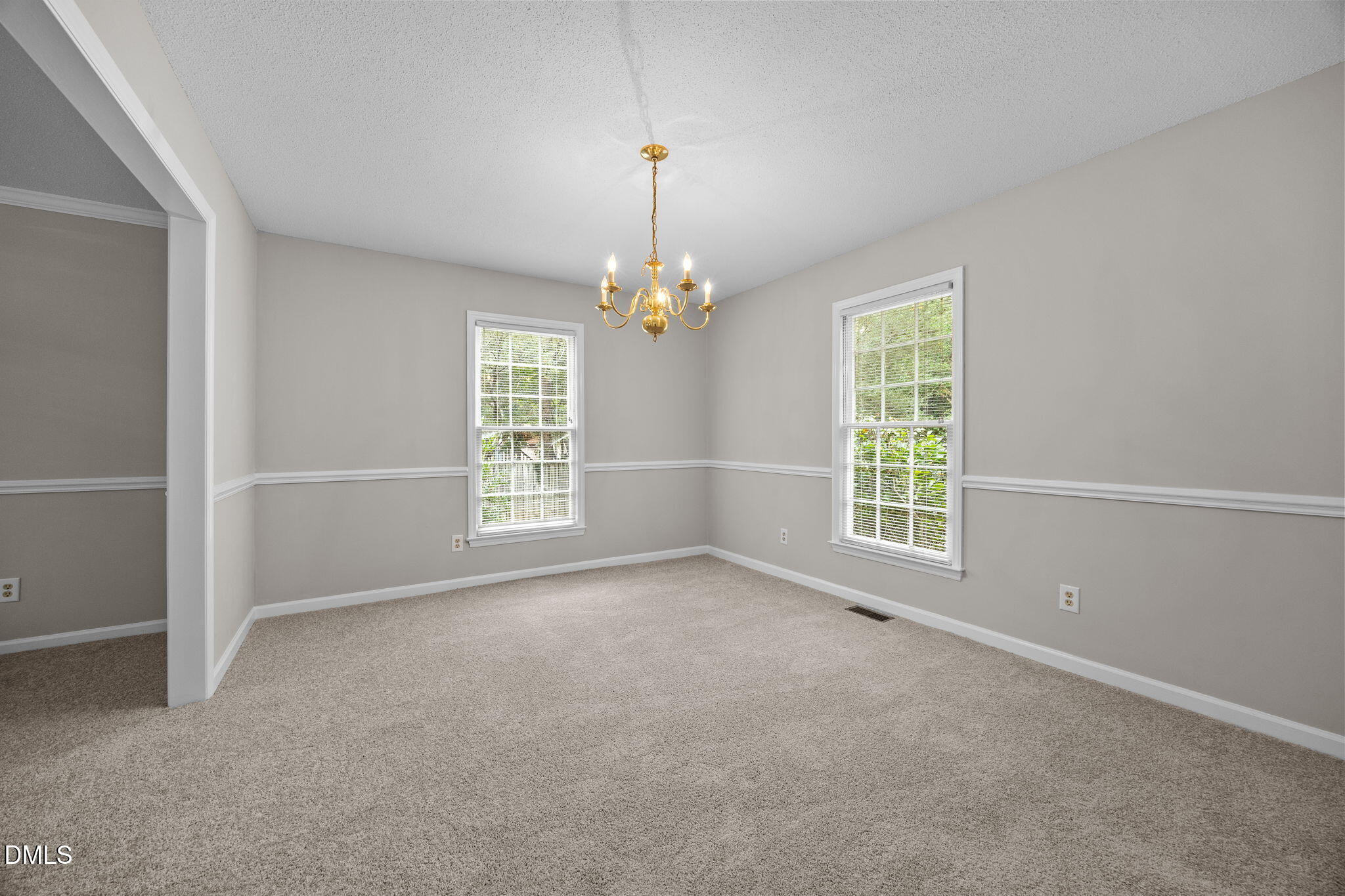 8405 Bells Lake Road Apex, NC 27539 - Photo 9 of 44 a view of an empty room with a window