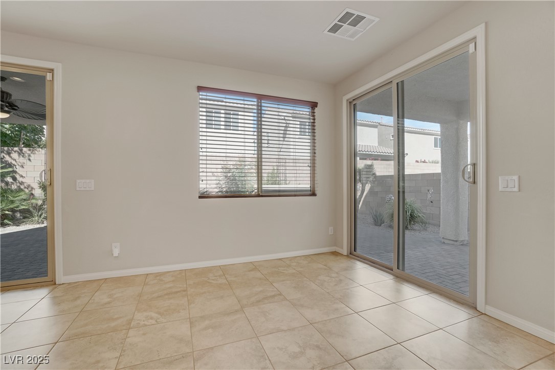 1145 Strada Pecei Henderson, NV 89011 - Photo 17 of 61 Unfurnished room featuring light tile patterned floors and a ceiling fan