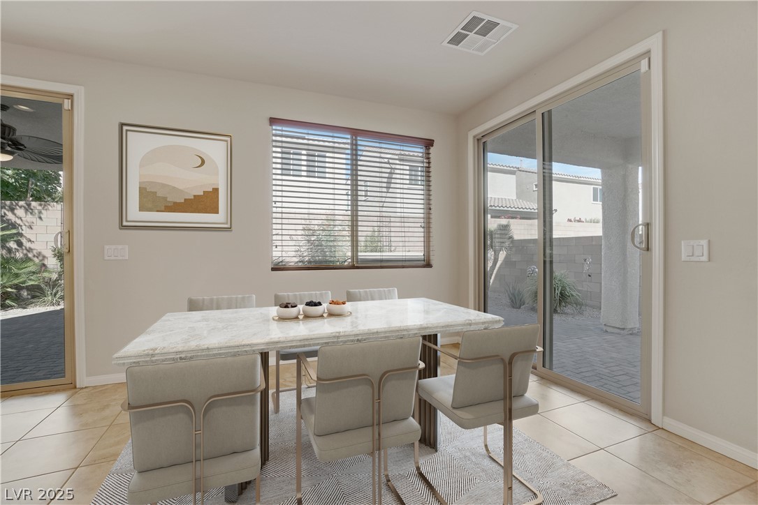 1145 Strada Pecei Henderson, NV 89011 - Photo 18 of 61 Dining area with plenty of natural light and light tile patterned flooring