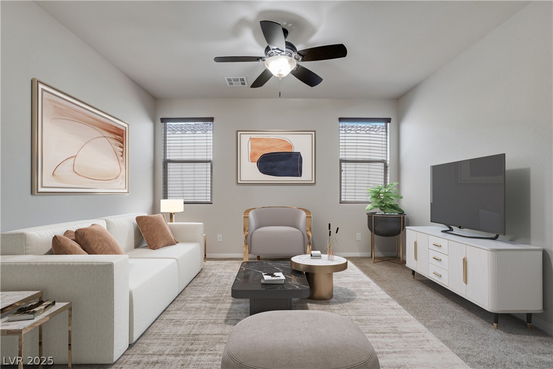 1145 Strada Pecei Henderson, NV 89011 - Photo 20 of 61 Living room featuring light colored carpet and ceiling fan