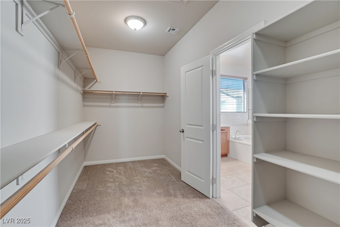 1145 Strada Pecei Henderson, NV 89011 - Photo 28 of 61 Walk in closet with light carpet