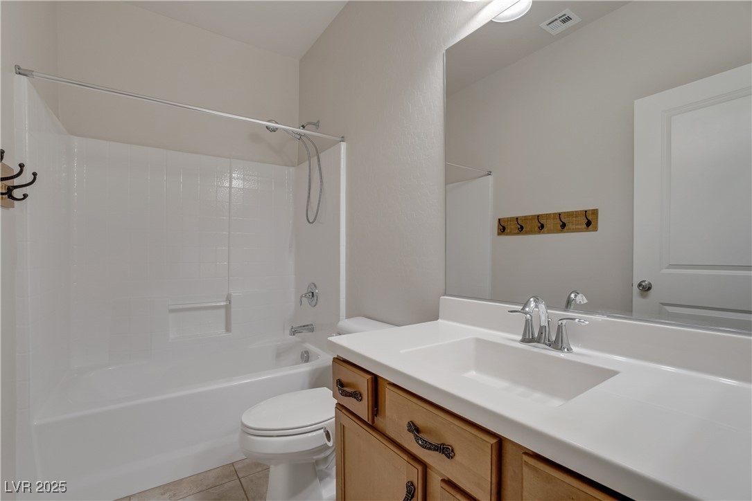 1145 Strada Pecei Henderson, NV 89011 - Photo 39 of 61 Full bathroom with vanity, tile patterned flooring, and bathtub / shower combination