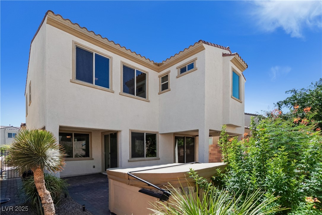 1145 Strada Pecei Henderson, NV 89011 - Photo 45 of 61 Mediterranean / spanish house with a tiled roof, stucco siding, and a hot tub