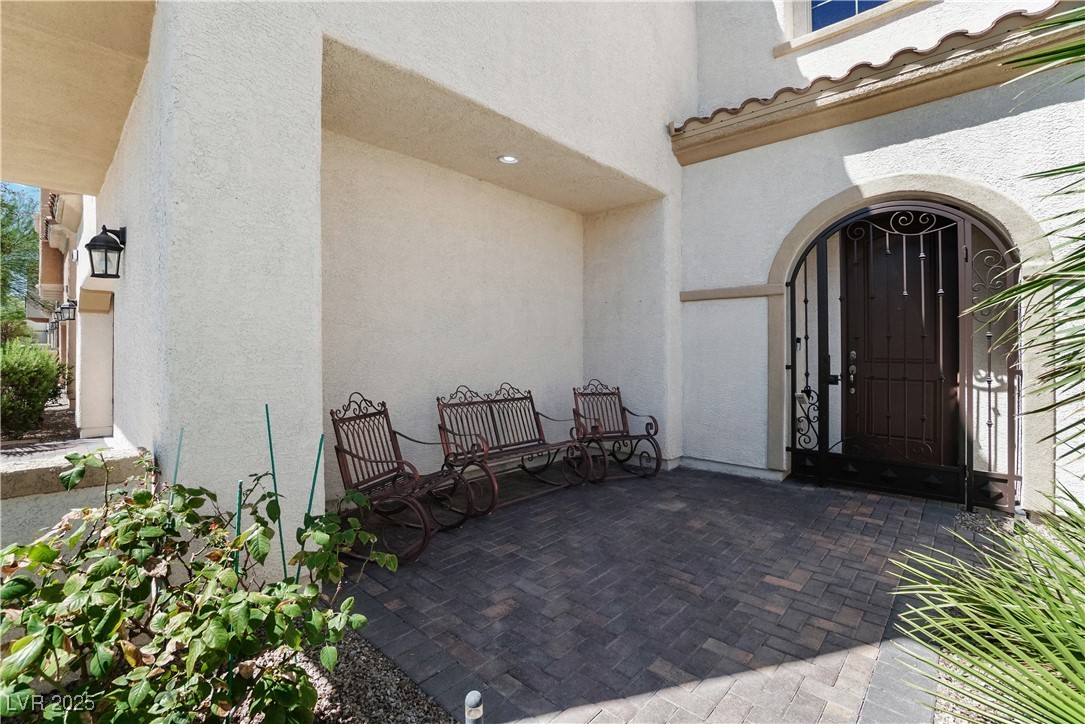1145 Strada Pecei Henderson, NV 89011 - Photo 5 of 61 Entrance to property featuring stucco siding