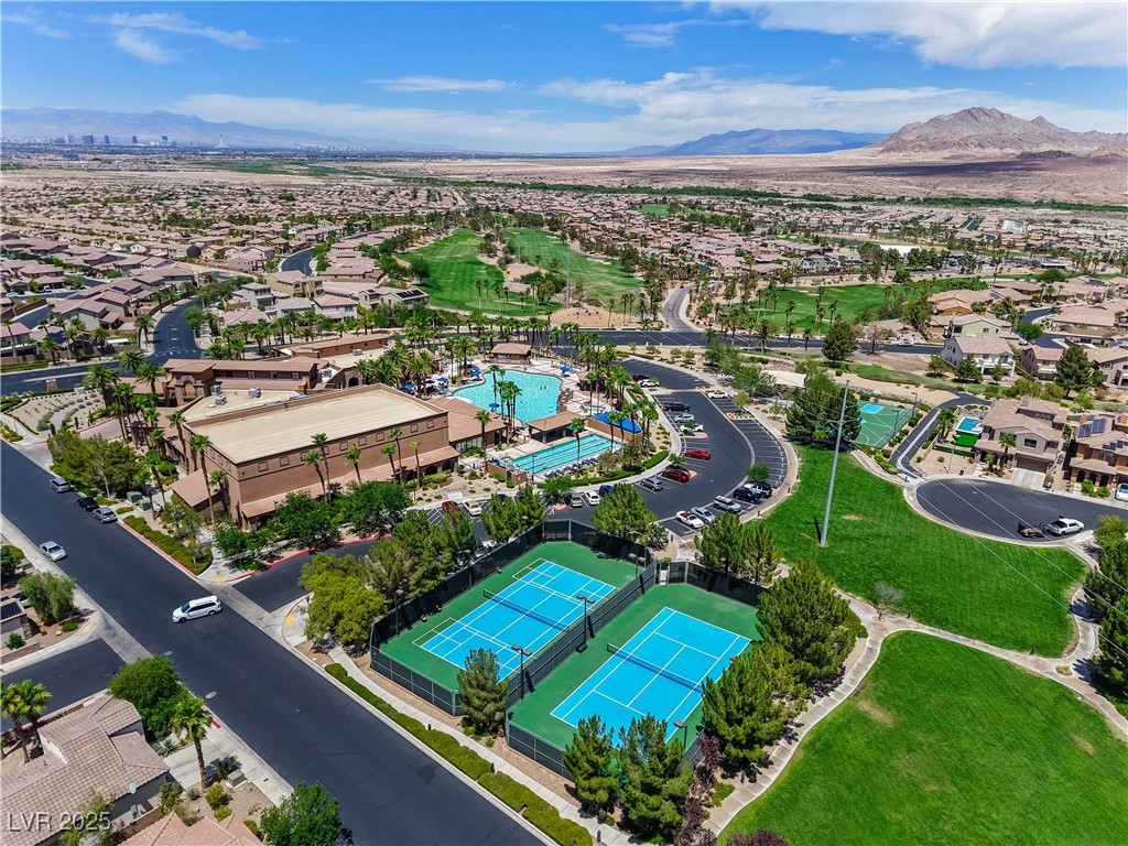 1145 Strada Pecei Henderson, NV 89011 - Photo 52 of 61 Aerial view of residential area featuring a mountainous background and a local golf course