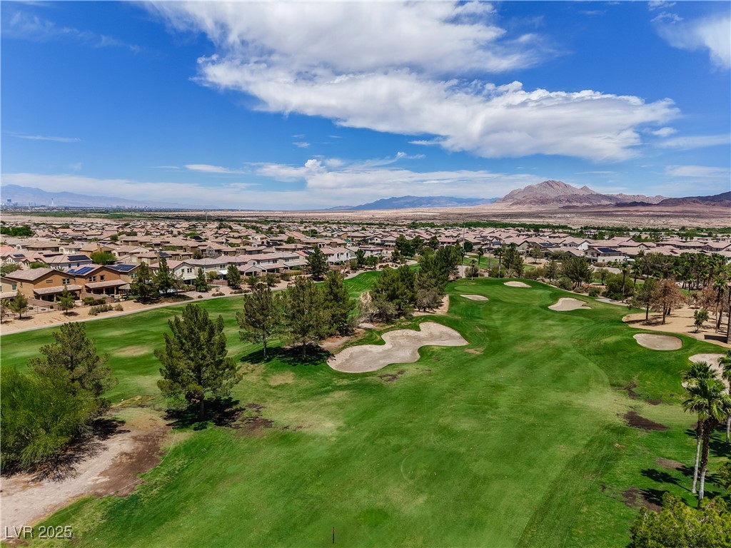 1145 Strada Pecei Henderson, NV 89011 - Photo 57 of 61 Aerial perspective of suburban area with a local golf course and a mountainous background