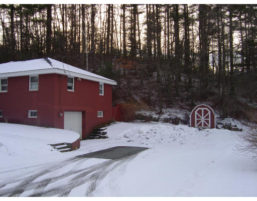 5 Leslie Road Rowley, MA 01969 - Photo 4 of 6 a front view of a house with parking area