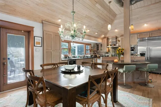 a bathroom with a granite countertop sink a mirror and shower