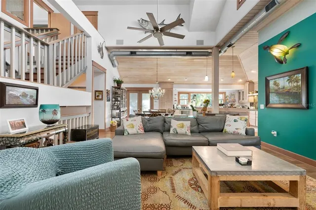 a bedroom with a bed a flat screen tv and a fireplace