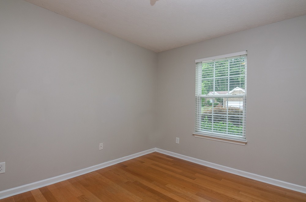 1912 Portview Drive Spring Hill, TN 37174 - Photo 13 of 20 a view of an empty room with wooden floor and a window