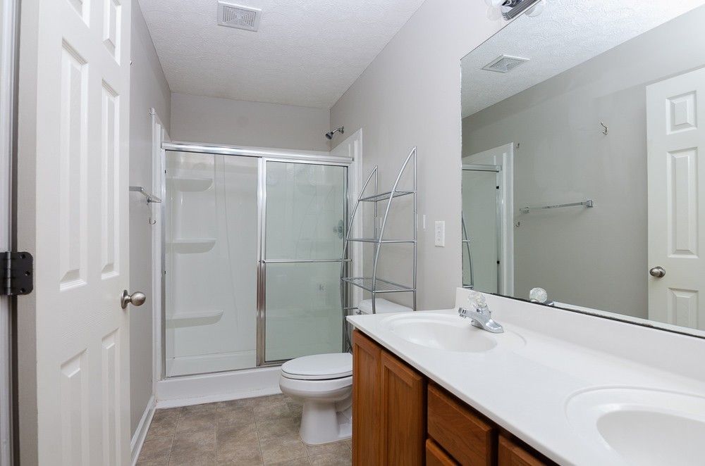 1912 Portview Drive Spring Hill, TN 37174 - Photo 17 of 20 a bathroom with a sink toilet and shower