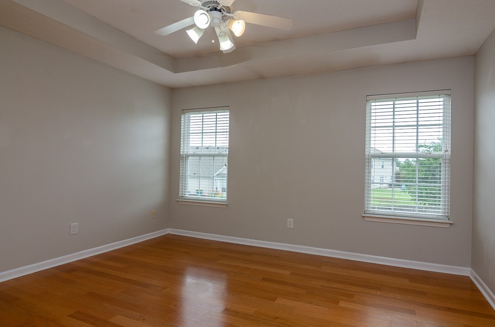 1912 Portview Drive Spring Hill, TN 37174 - Photo 18 of 20 a view of an empty room with wooden floor and a window