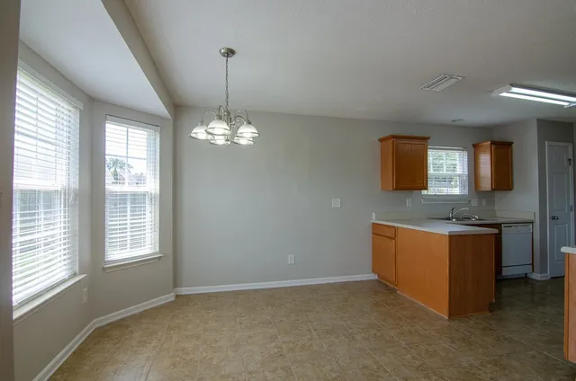a kitchen with stainless steel appliances granite countertop a stove and a sink