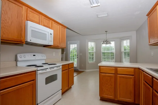a kitchen with a stove and a microwave