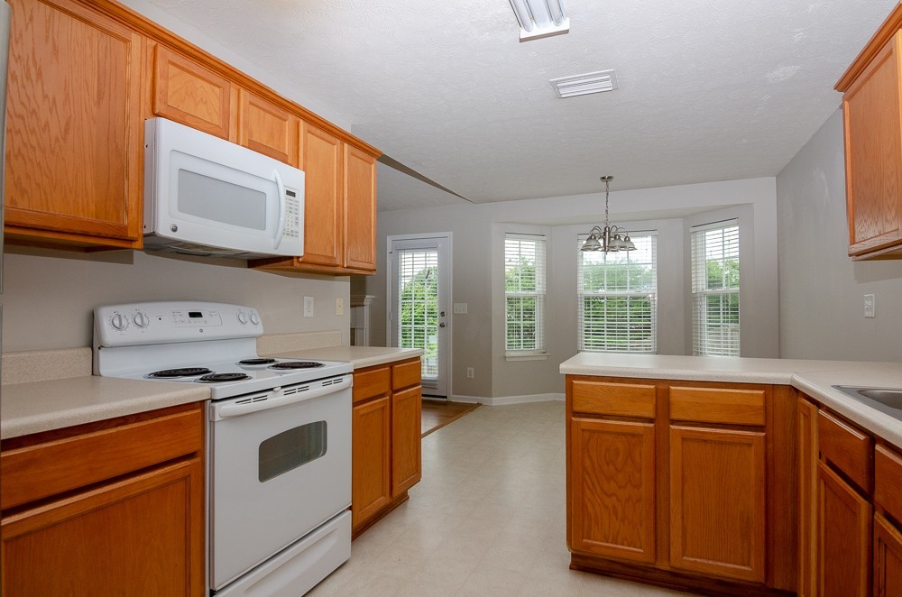 1912 Portview Drive Spring Hill, TN 37174 - Photo 10 of 20 a kitchen with a stove and a microwave