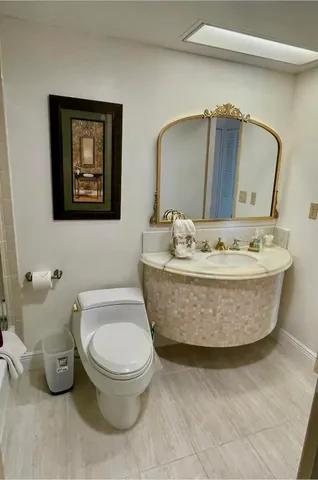 a bathroom with a toilet mirror