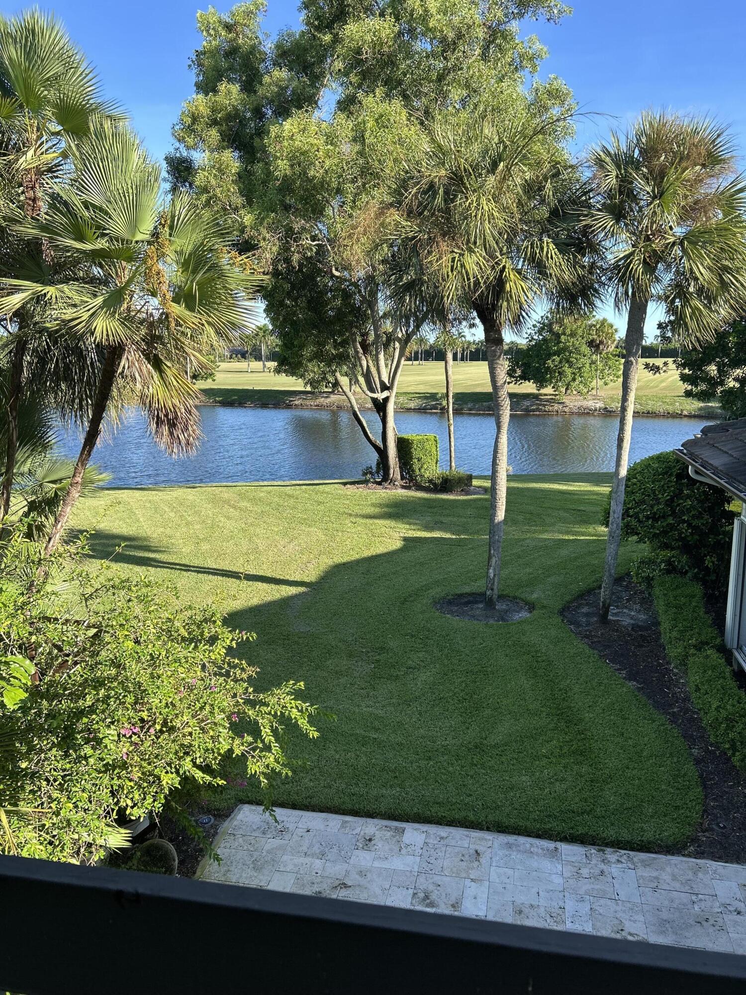 13321 Polo Club Road, Unit C 202 Wellington, FL 33414 - Photo 15 of 20 a view of a backyard