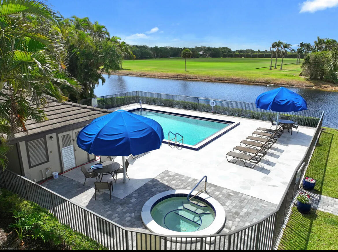 13321 Polo Club Road, Unit C 202 Wellington, FL 33414 - Photo 19 of 20 swimming pool view with a seating space