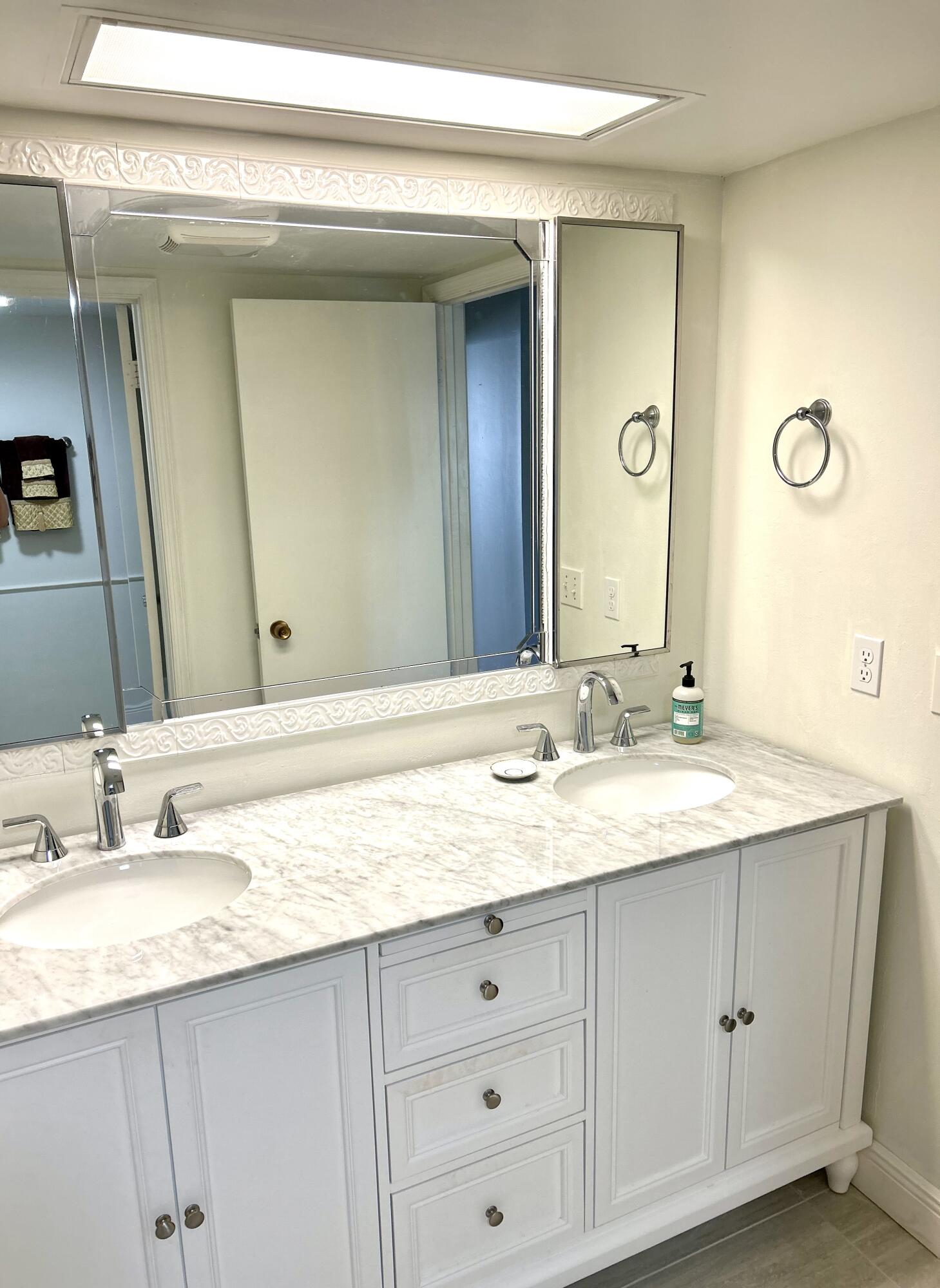 13321 Polo Club Road, Unit C 202 Wellington, FL 33414 - Photo 9 of 20 a bathroom with a granite countertop sink double and mirror