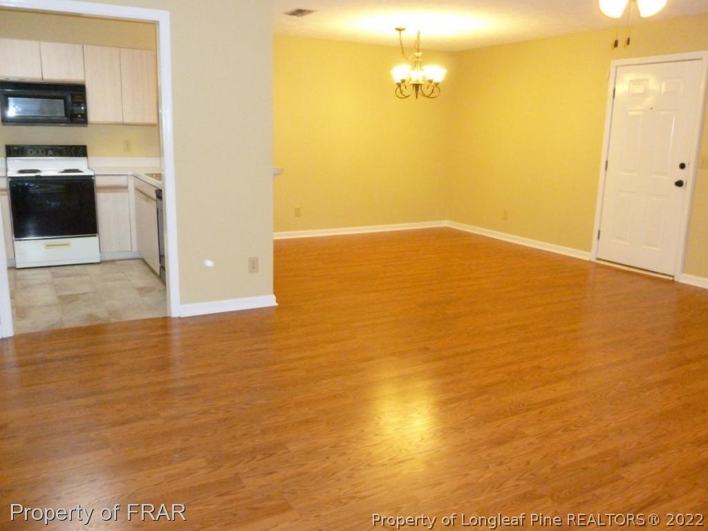 1813 Sardonyx Road Fayetteville, NC 28303 - Photo 5 of 25 a view of kitchen and empty room