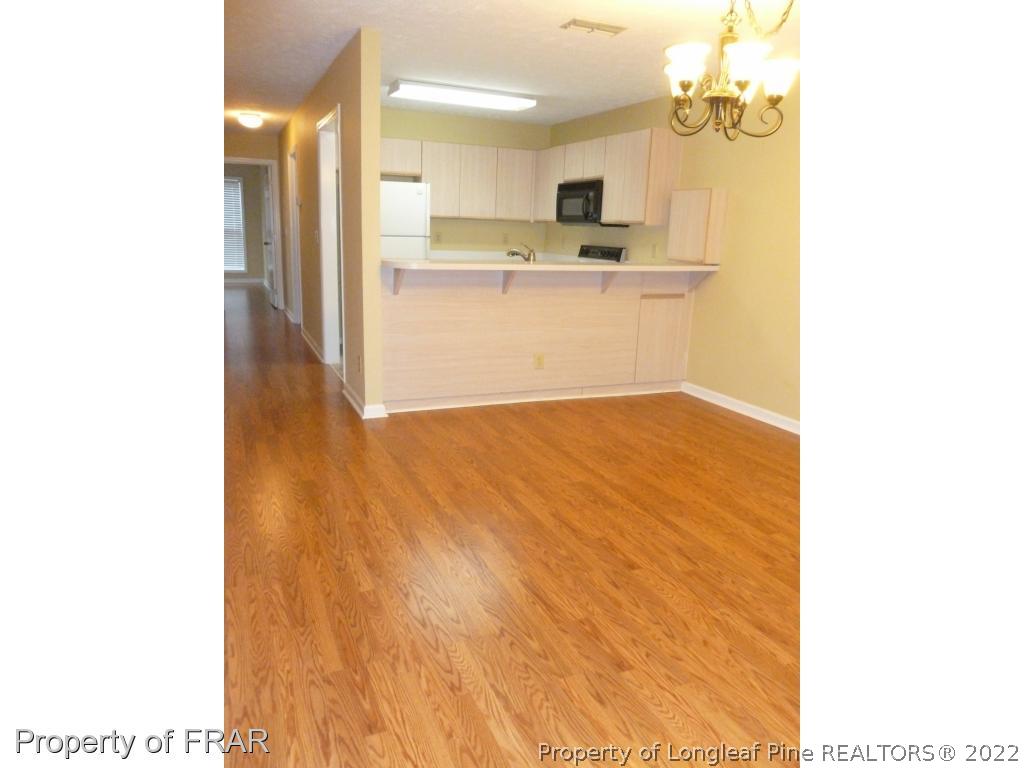 1813 Sardonyx Road Fayetteville, NC 28303 - Photo 6 of 25 a view of a kitchen with a sink