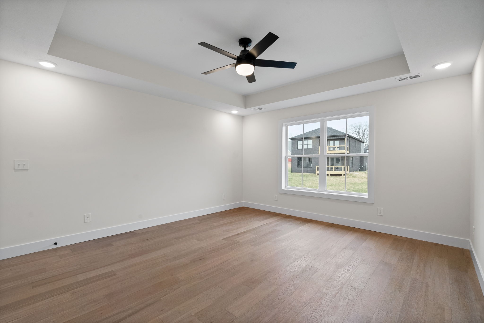 15 Rustling Oaks Court Pleasant View, TN 37146 - Photo 28 of 50 a view of an empty room with wooden floor and a window