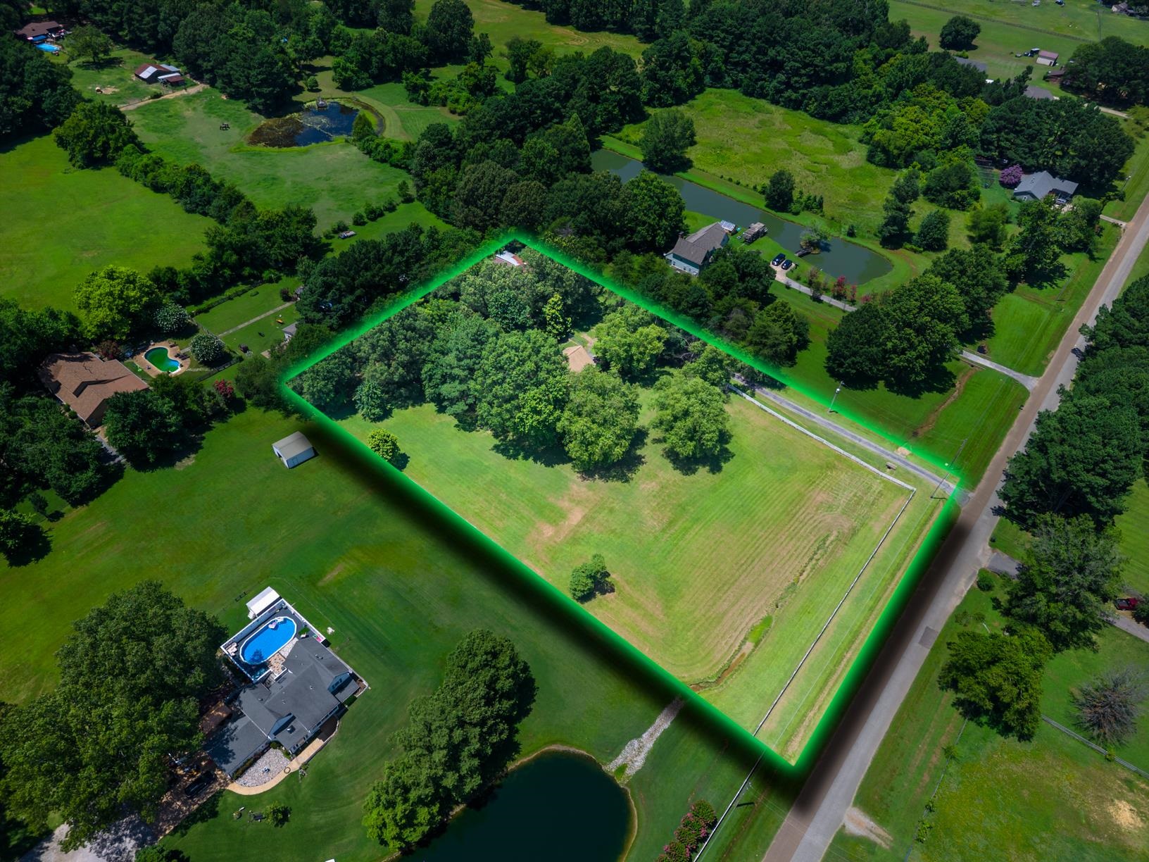 5015 Eagles Nest Lane Bartlett, TN 38002 - Photo 2 of 39 Aerial view of property's location featuring a large body of water and property parcel outlined