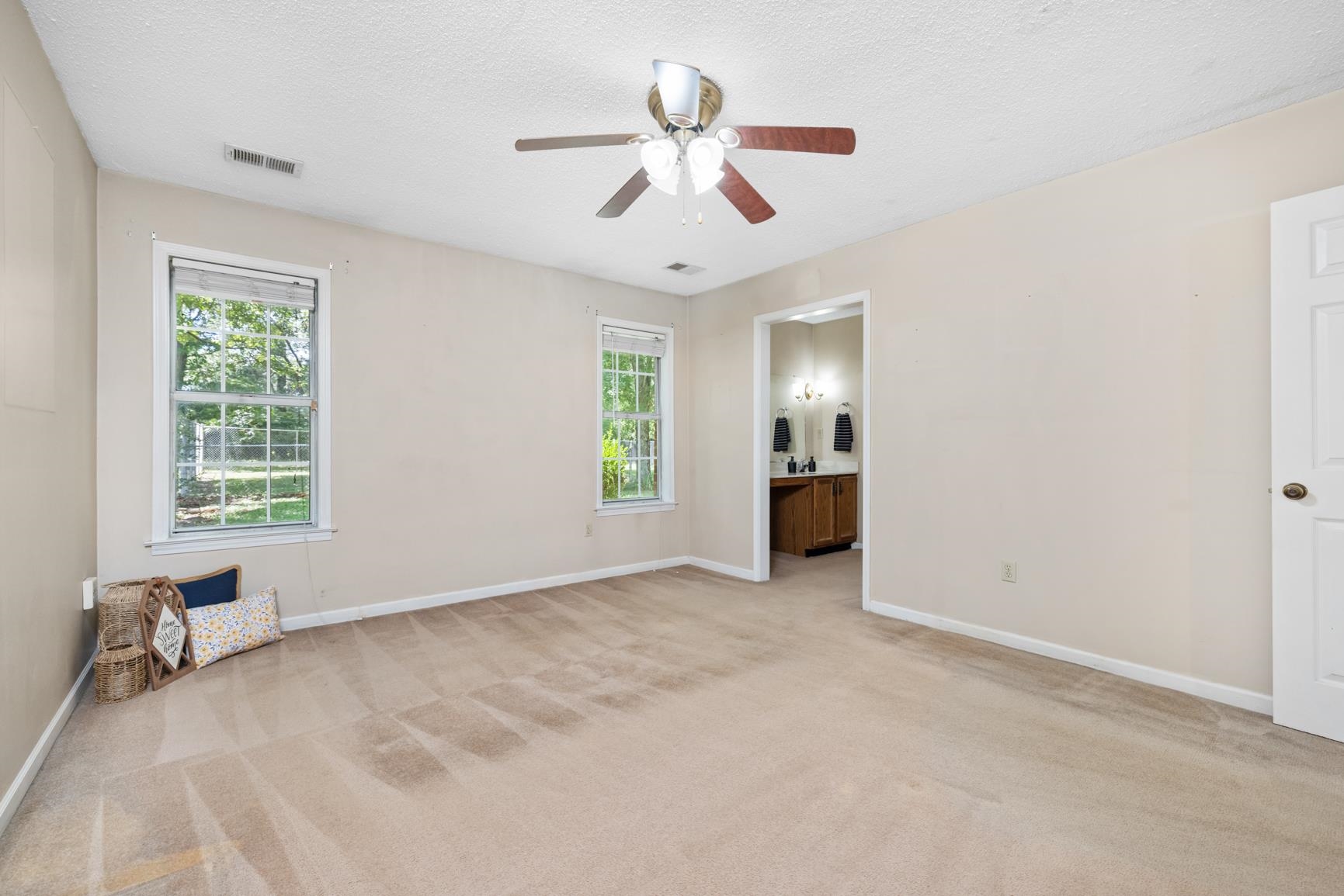 5015 Eagles Nest Lane Bartlett, TN 38002 - Photo 25 of 39 Empty room with light colored carpet, a ceiling fan, and a textured ceiling