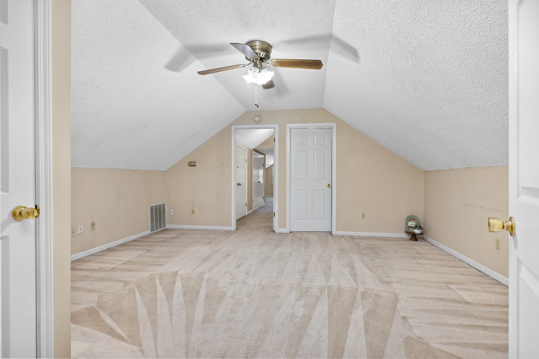 5015 Eagles Nest Lane Bartlett, TN 38002 - Photo 31 of 39 Additional living space featuring a textured ceiling, carpet floors, vaulted ceiling, and a ceiling fan